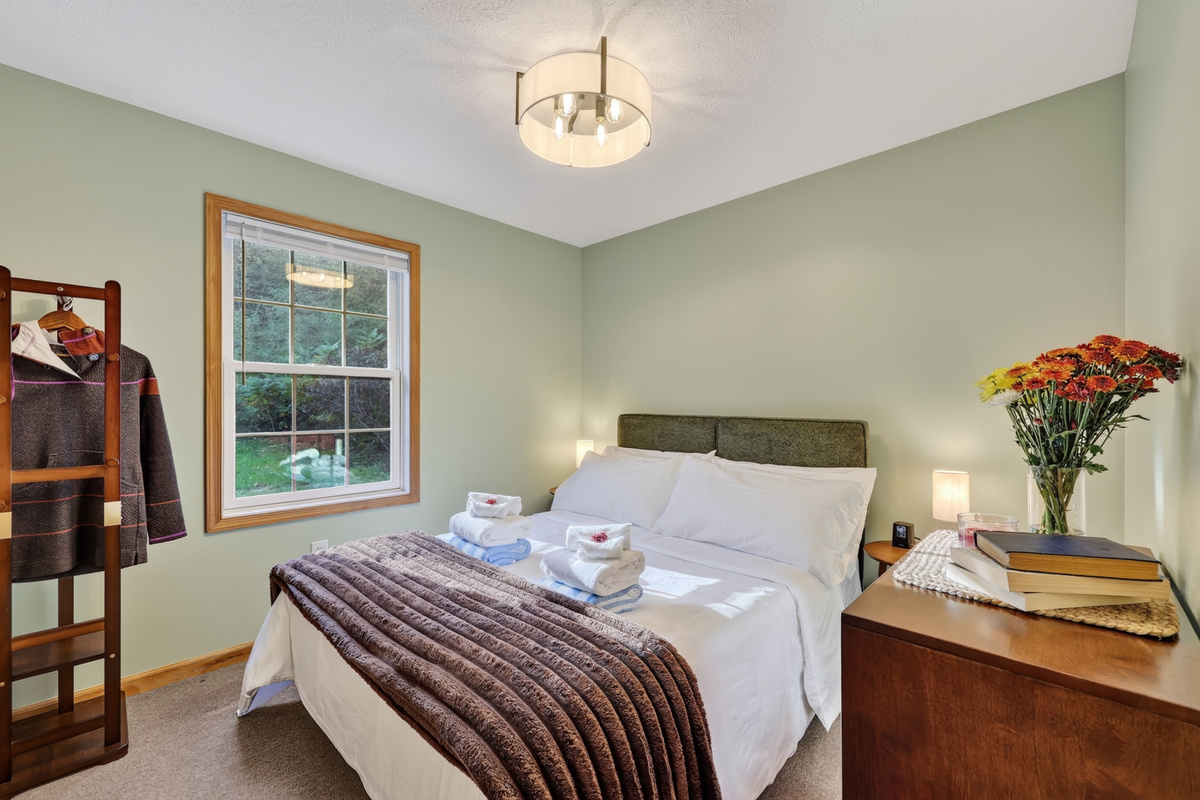 The first bedroom on the rear of the house with a southern facing window overlooking the back yard and letting in some lovely morning light.