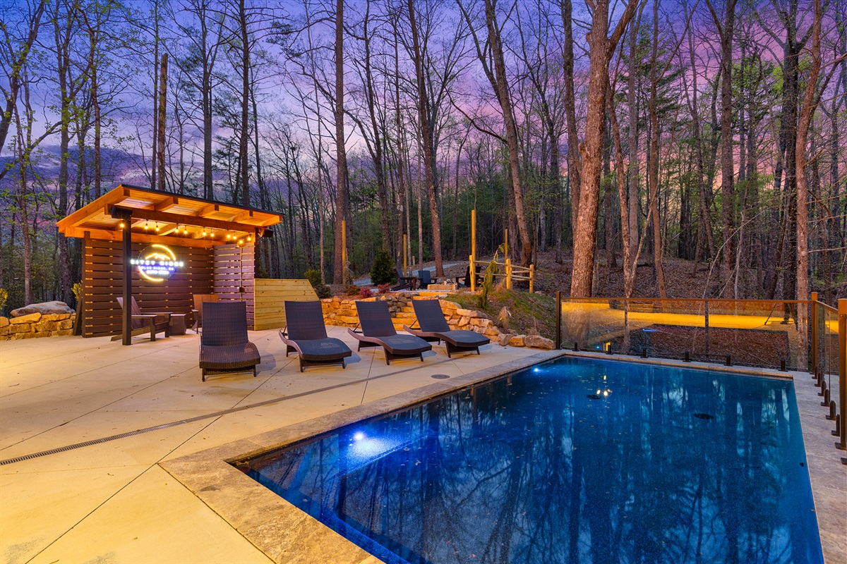 At Ritzy Ridge rustic charm blends with sleek comfort in your personal outdoor retreat with the pleasures of a heated pool.
