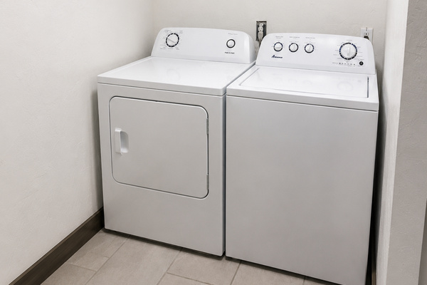 Laundry  area inside of bathroom 