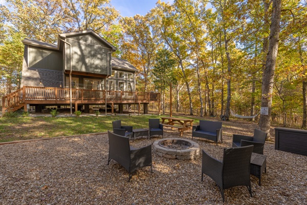 Outdoor fire pit and view of the back of the chalet