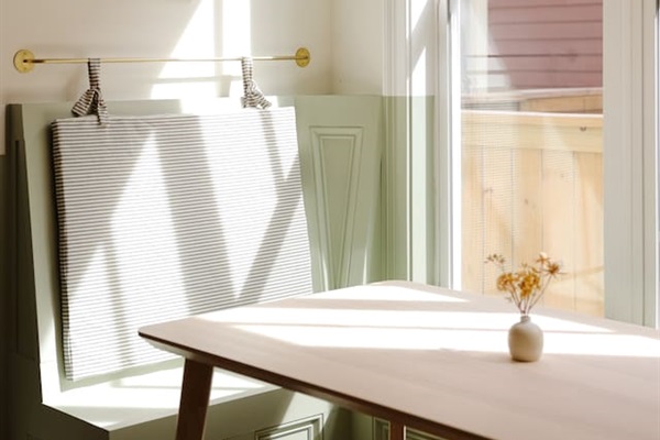The breakfast nook may be our favorite part of the house. Featuring custom cushions and the oversized rice paper lantern from Hay. It's a great place to share a coffee or take a meeting.