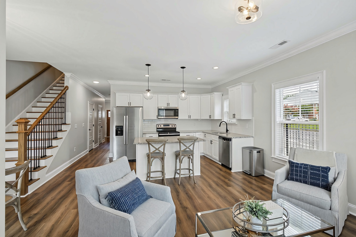 Main level with the kitchen, living room, and stairs to the bedrooms