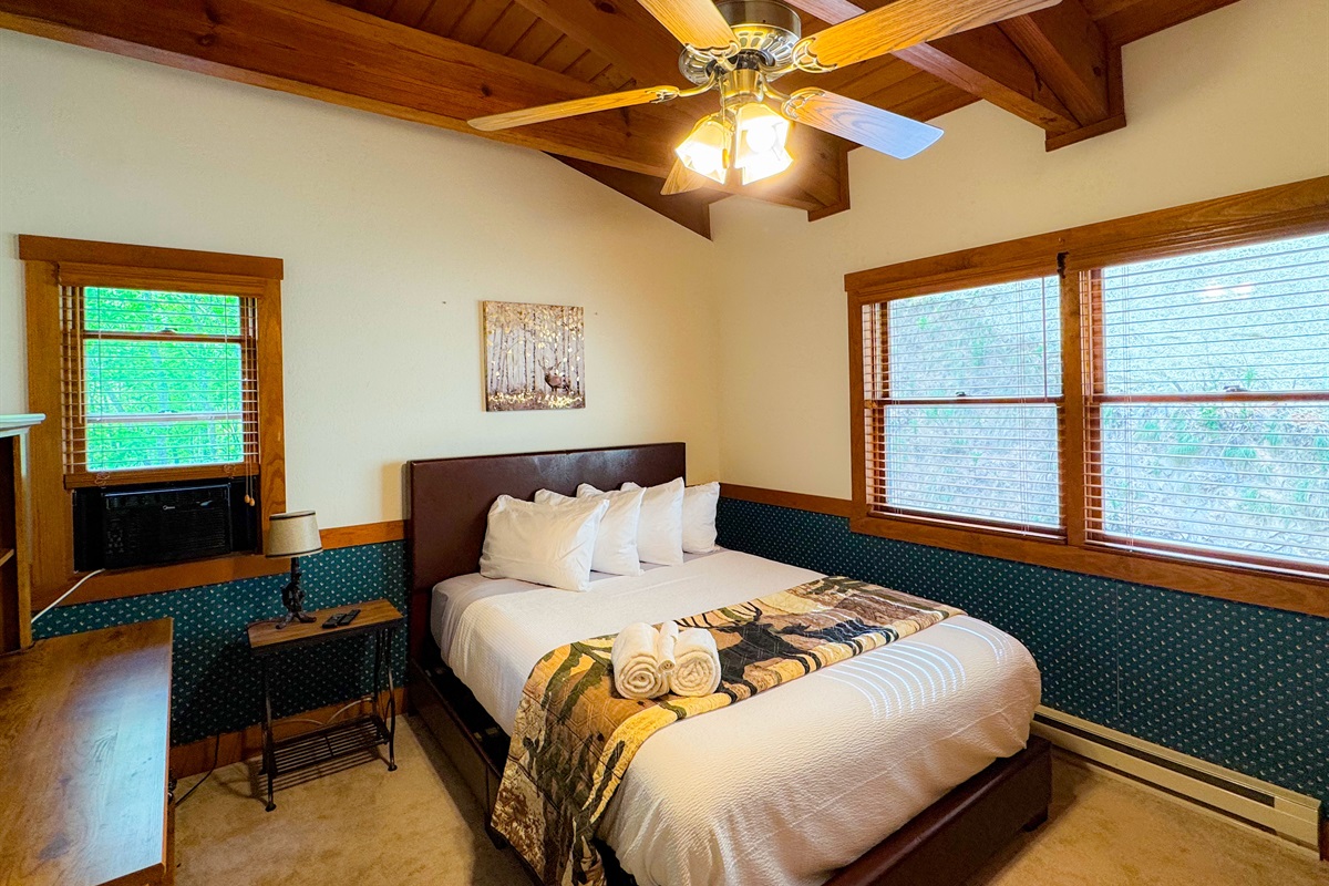 The upper level bedroom has a queen size bed and its own TV