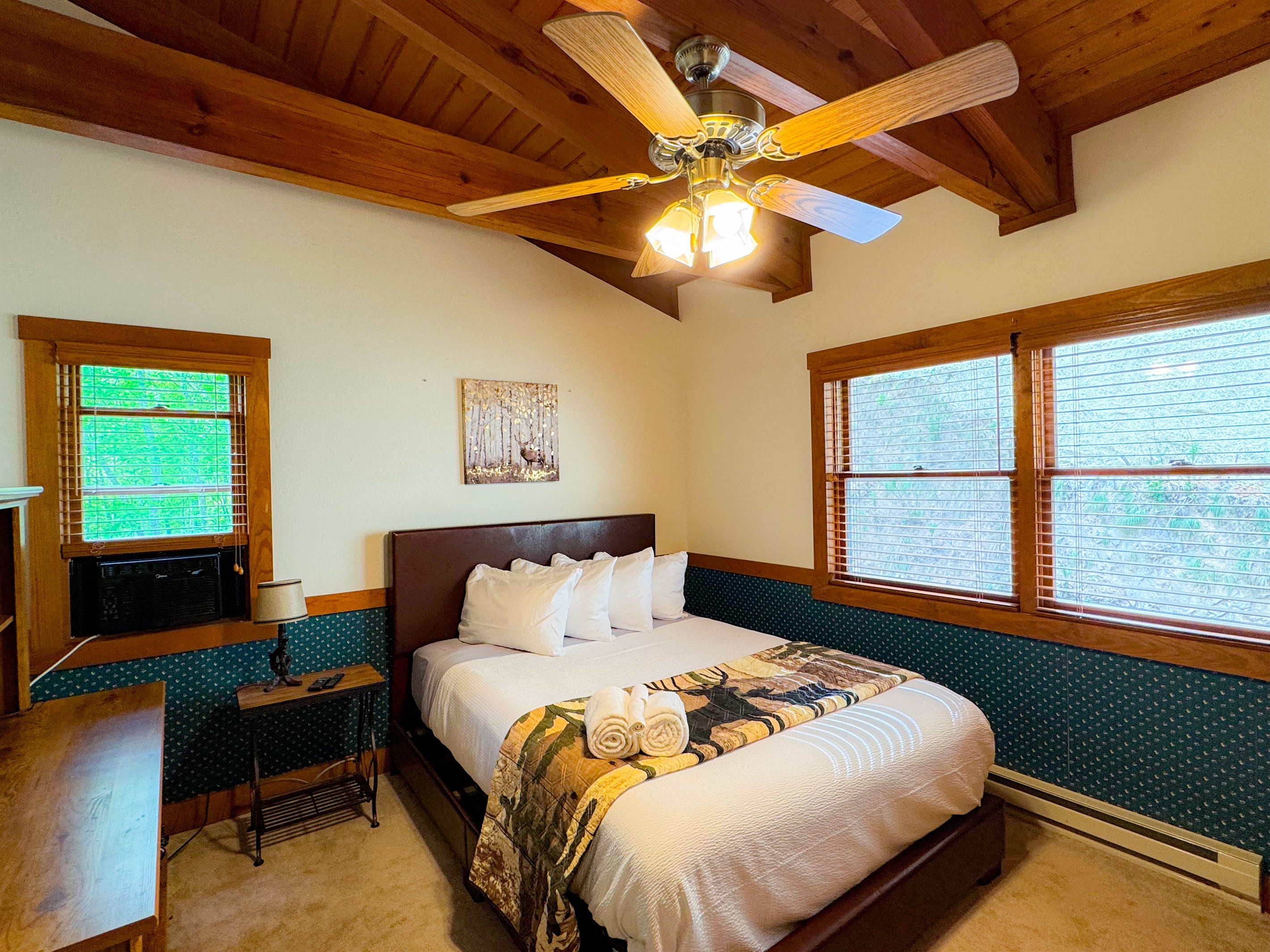 The upper level bedroom has a queen size bed and its own TV