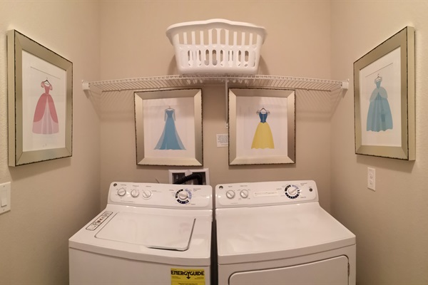 Laundry room: washer, dryer, laundry basket, iron, ironing board
