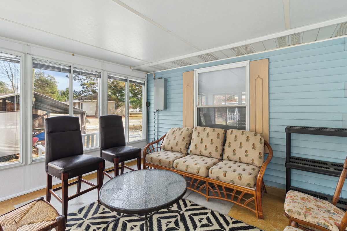 4-season sunroom with plenty of seating and storage for wet items!