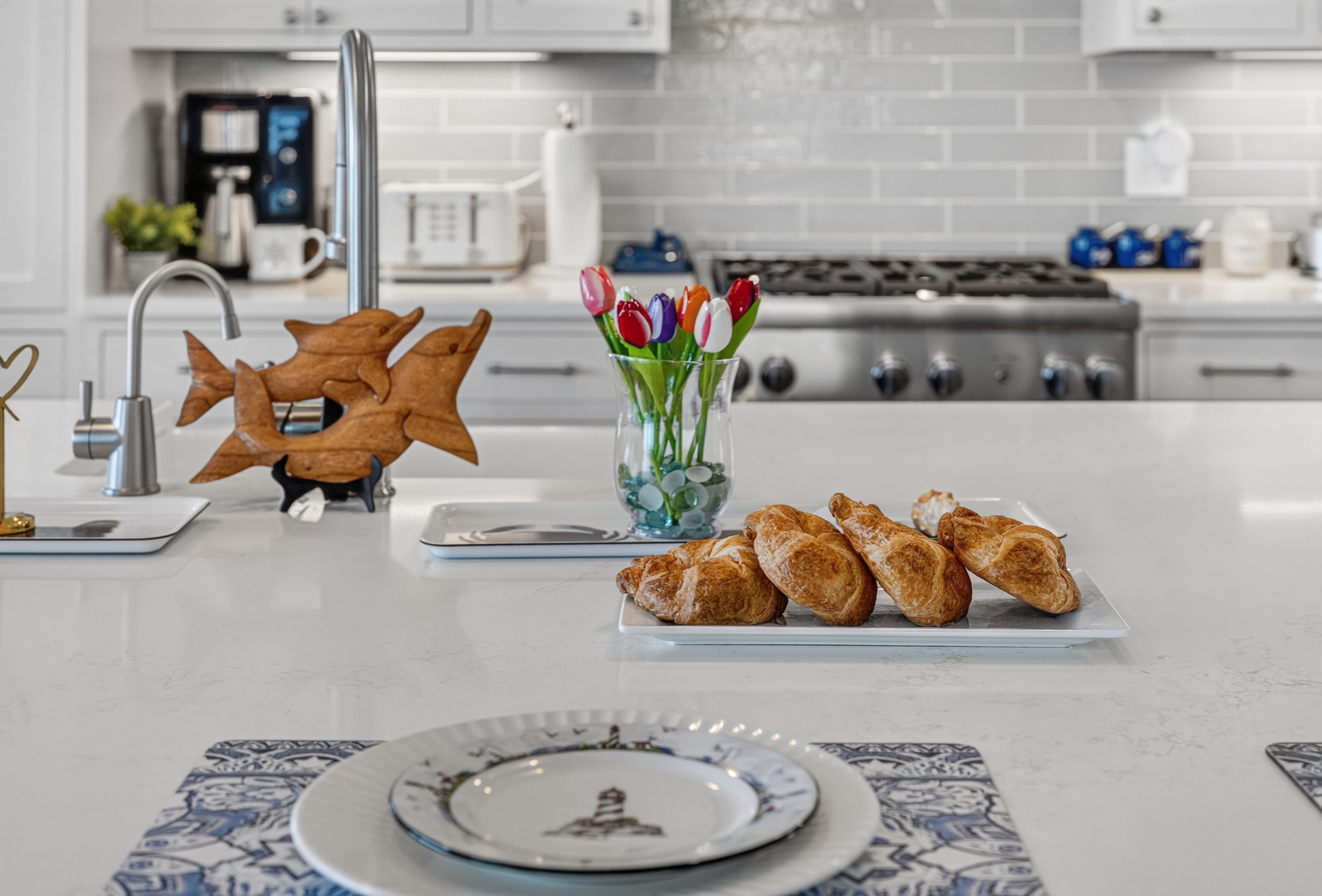 Thoughtfully designed kitchen with ample prep space and elegant coastal touches