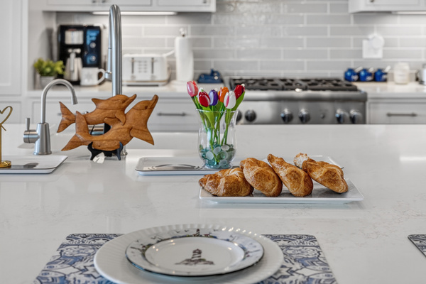 Thoughtfully designed kitchen with ample prep space and elegant coastal touches