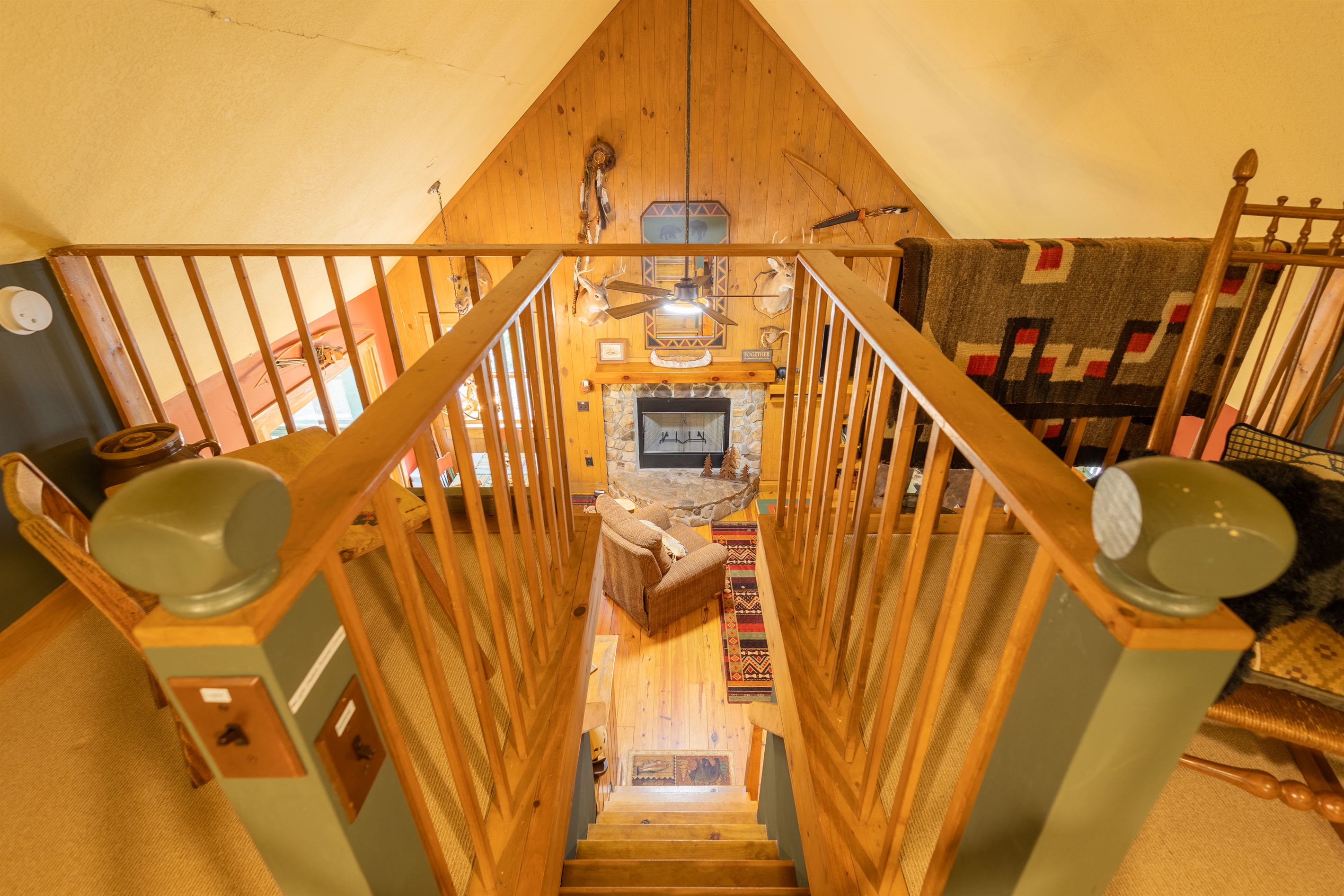 Overlooking the main living area below, the loft adds extra charm and flexible sleeping arrangements to the cabin. Please note that the loft stairs are steep.