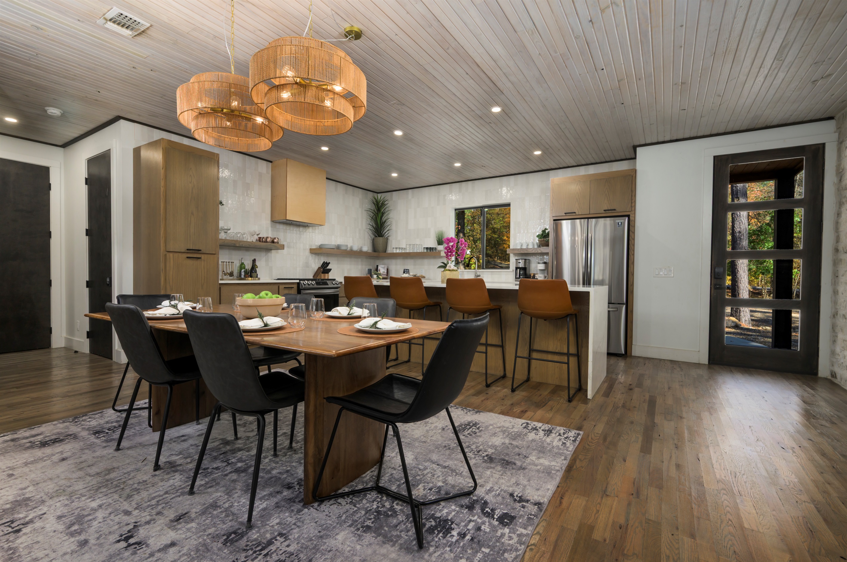 Open-concept kitchen and dining area in our luxury Broken Bow cabin, perfect for family meals and entertaining