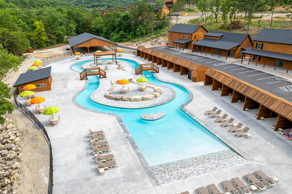 Float the brand-new lazy river and outdoor pool, the sparkling centerpiece of Tall Timbers Camp near Branson.