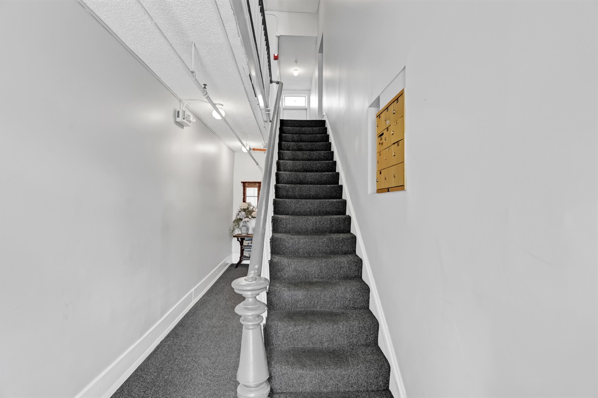 Charming staircase leads you up to your private second-floor retreat.