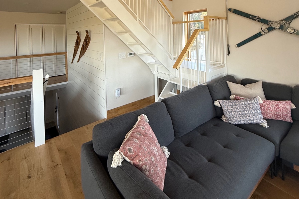 Custom staircase leading to the loft level