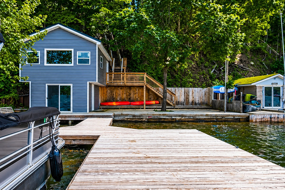 private dock for endless lake fun. 🛶🏠🌳 Note: Boat house is not for guest use.