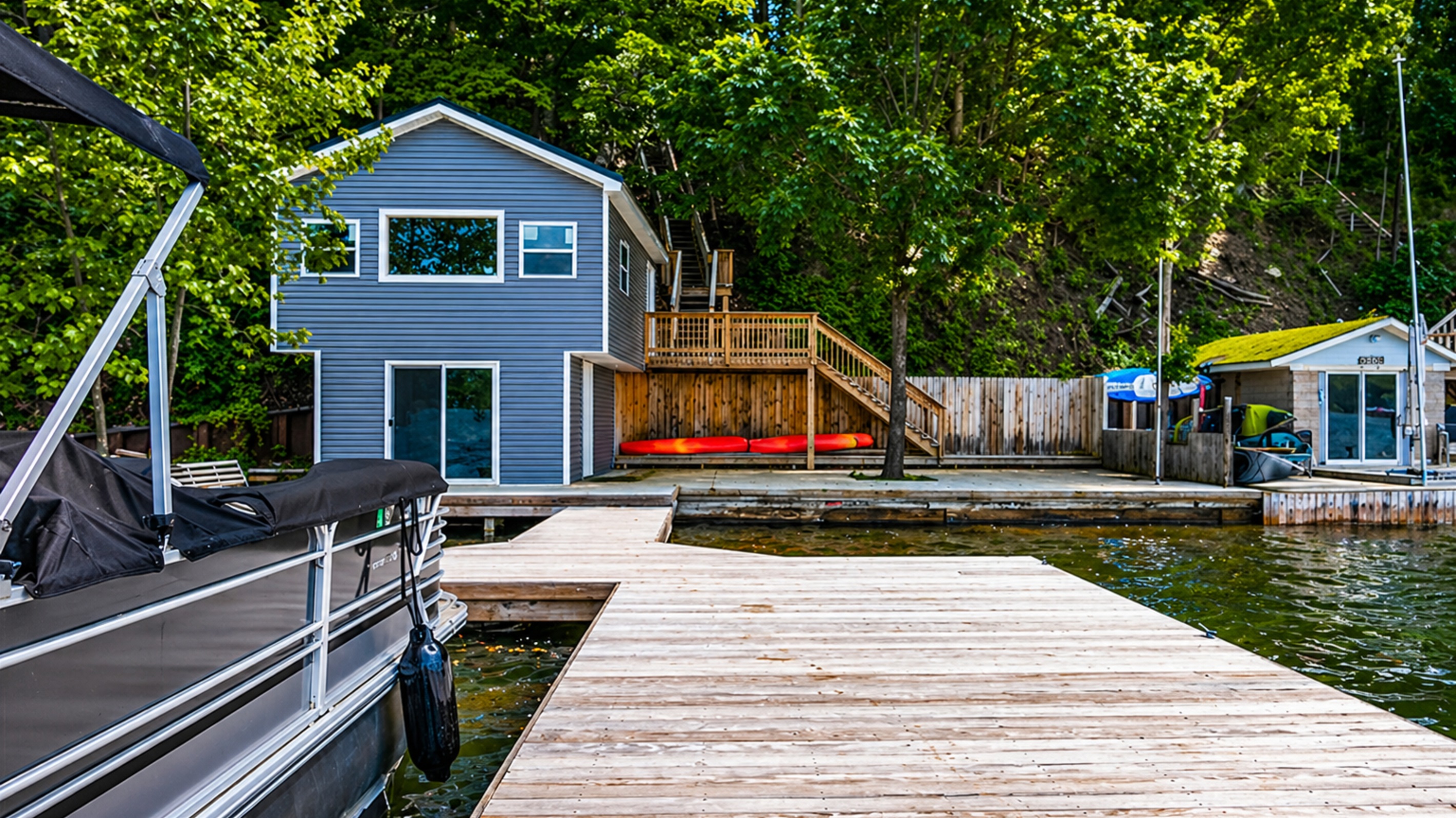 private dock for endless lake fun. 🛶🏠🌳 Note: Boat house is not for guest use.