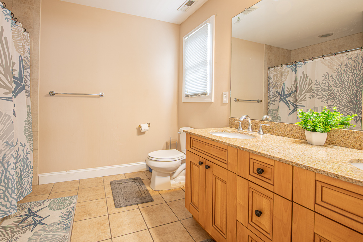 Bathroom 2 with Double Vanity and Tile Flooring