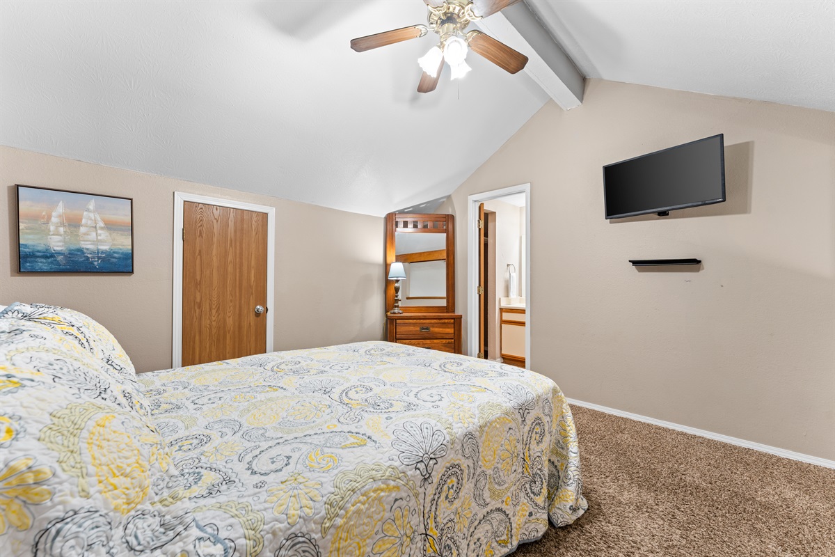 The upstairs loft bedroom gives guests a tucked-away space of their own.
