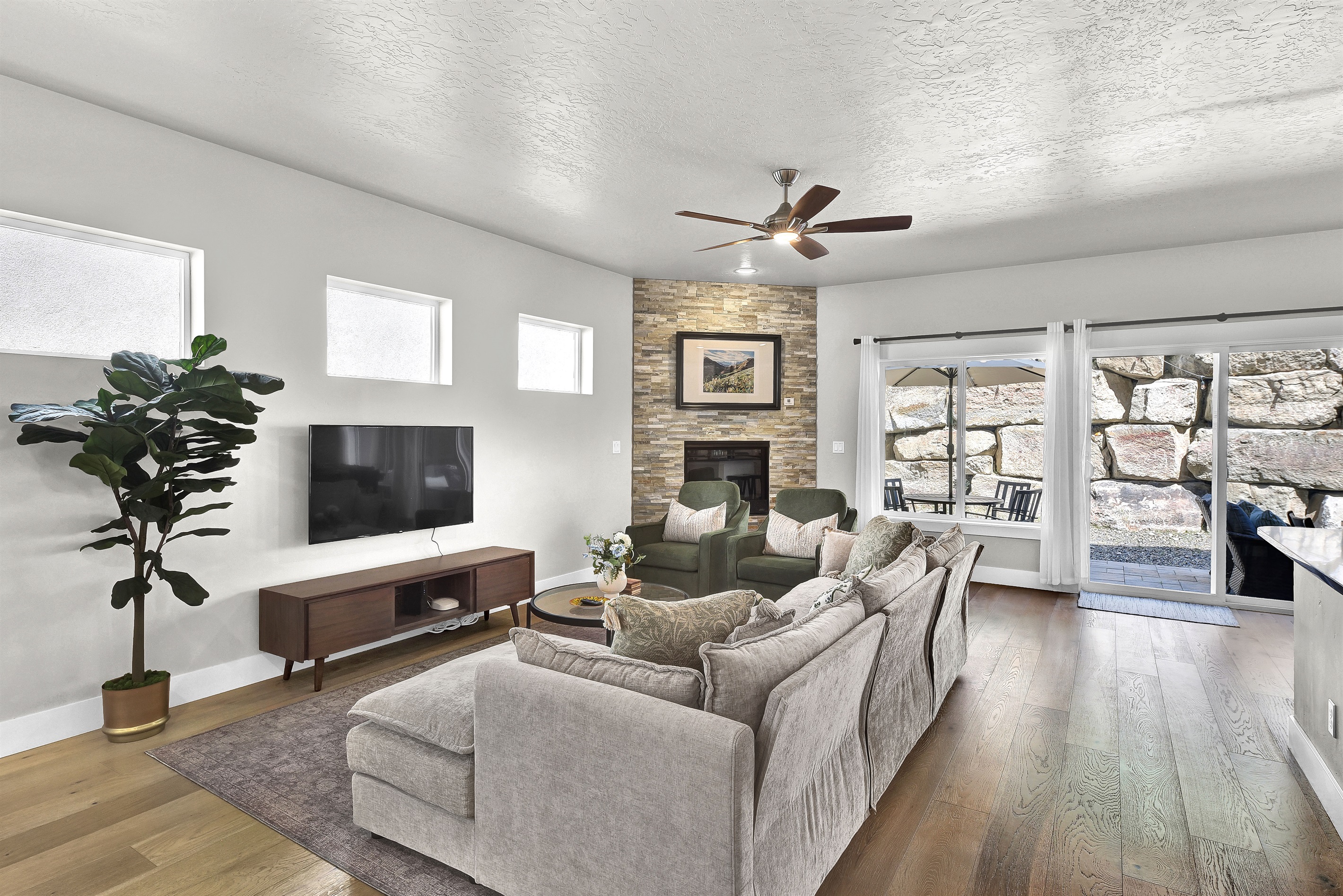 Living Room with TV, gas fireplace, and comfortable seating