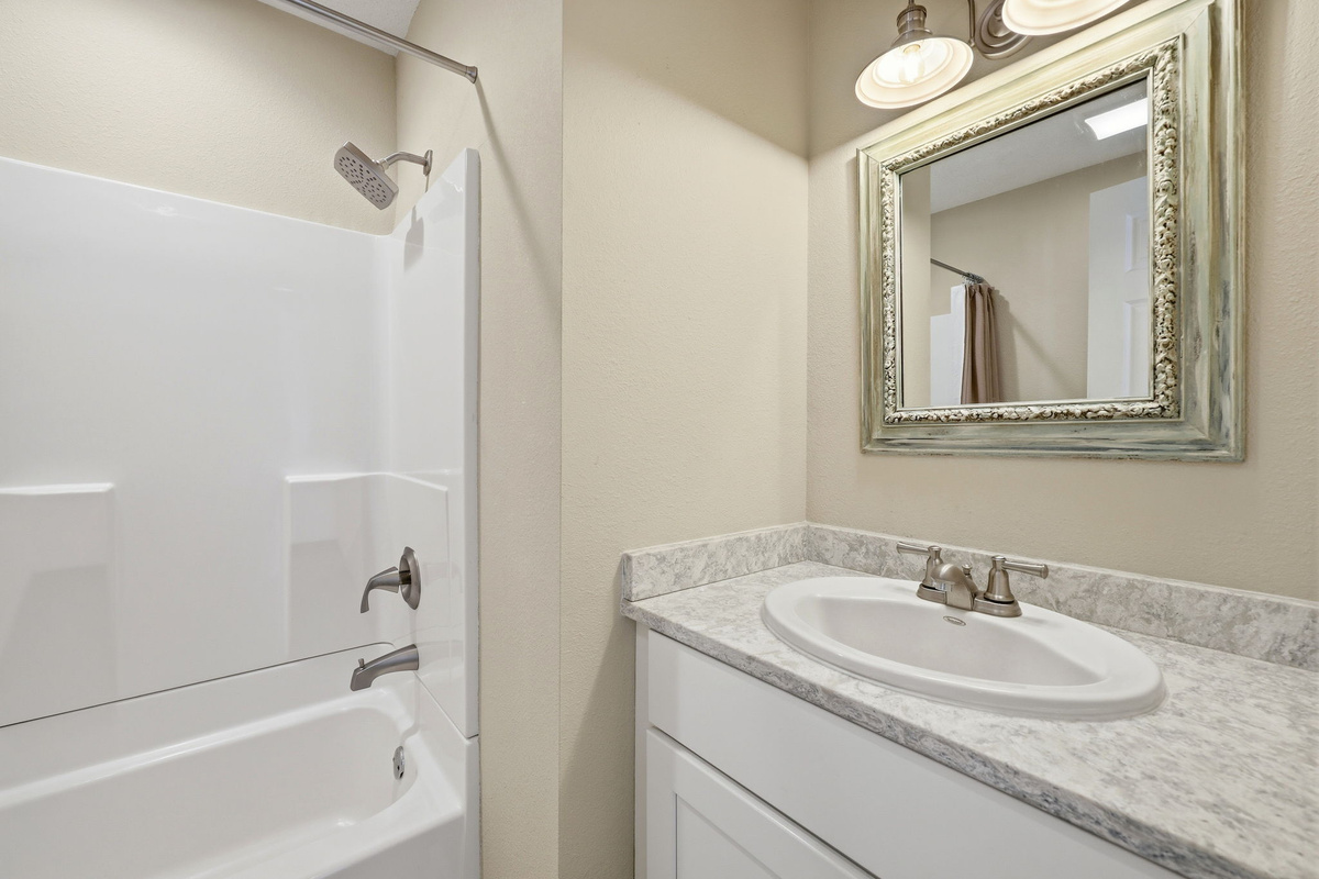A conveniently located hall bath - perfect for family and friends.