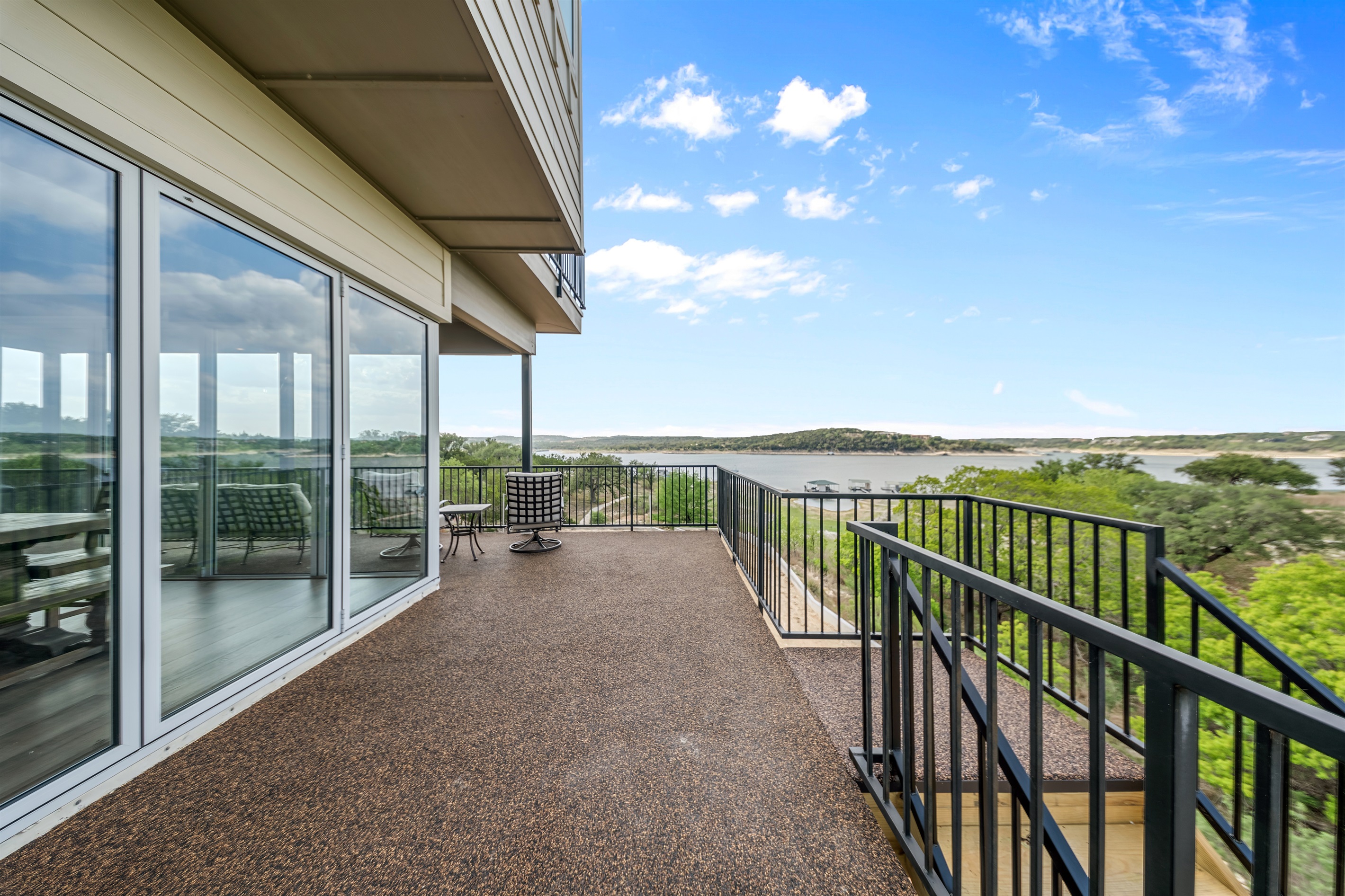 - Lakeview balcony with grill and seating for outdoor relaxing time - Scenic water views create perfect moments for sunrise or sunset - Spacious outdoor area enhances your lake getaway enjoyment