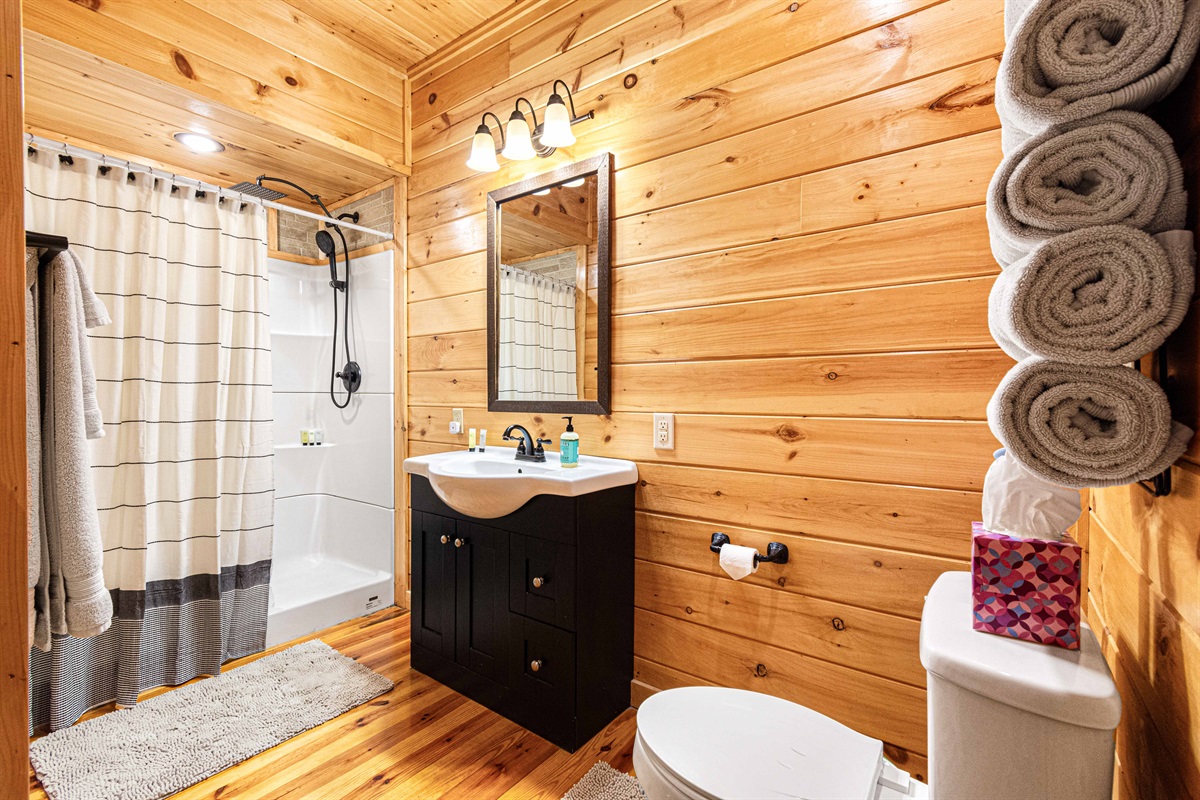 Spa-Like Bathroom: Rustic charm meets modern convenience in a serene space for refreshment!