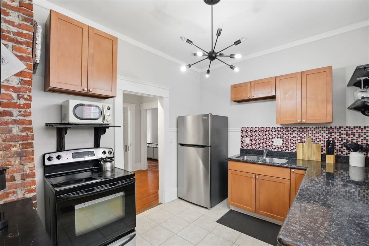 Full kitchen with everything needed. Oven, microwave, refrigerator and more