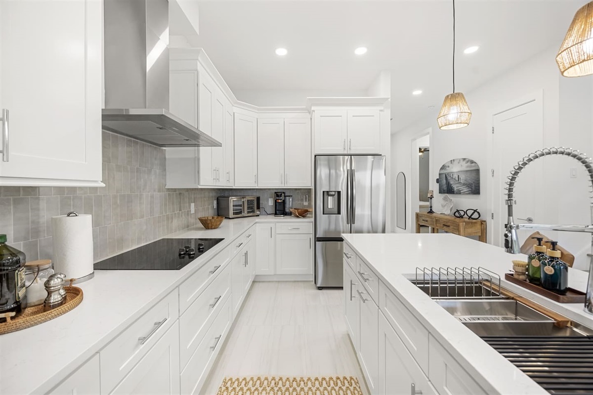 Our kitchen is fully stocked with everything you need for a comfortable stay, including high-end appliances and essentials.