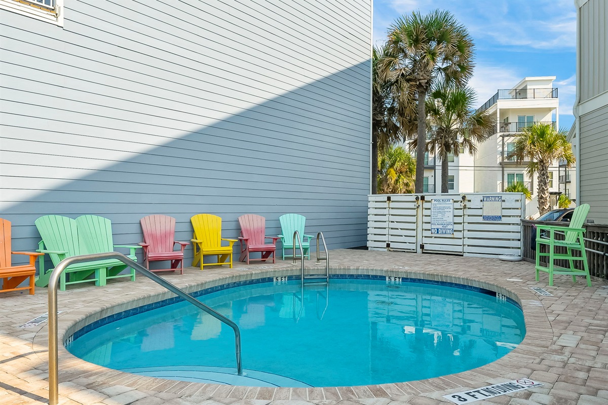 Swim, sun, or stroll: enjoy the shared beachfront pool, sundeck, outdoor shower, and private boardwalk to the sand — plus a shared grill for those perfect cookout nights.