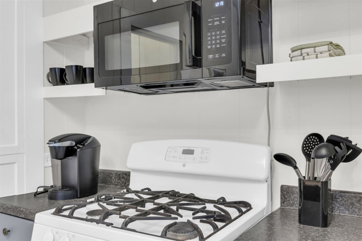 Kitchen with gas range and modern appliances.