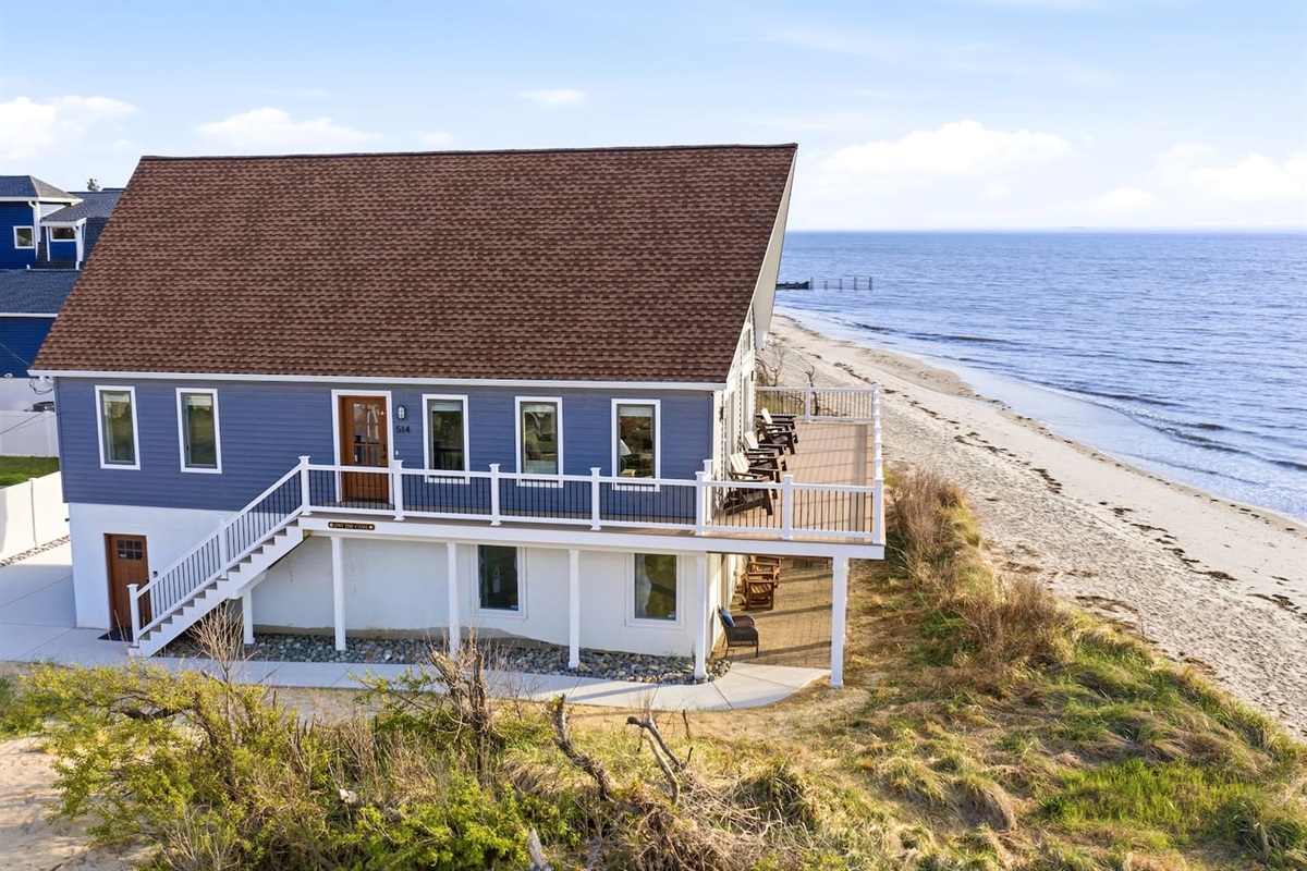 Escape to this stunning beachfront property. Perfectly situated on the shore, this home offers expansive decking for breathtaking ocean views, direct beach access, and the ultimate serene setting for a luxury coastal getaway.