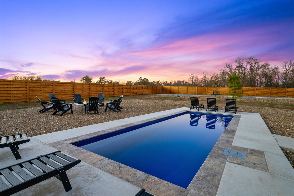 The modern pool area offers plenty of loungers and open space for sunbathing or cooling off on warm days.
