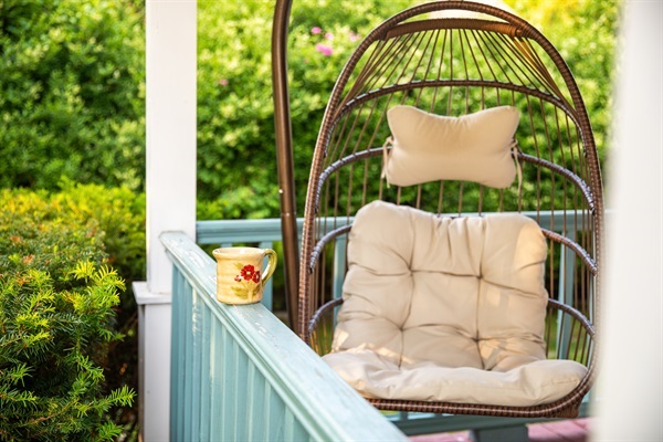 Start your morning in the cozy swing chair, surrounded by garden serenity. The perfect spot for coffee, calm, and quiet moments.