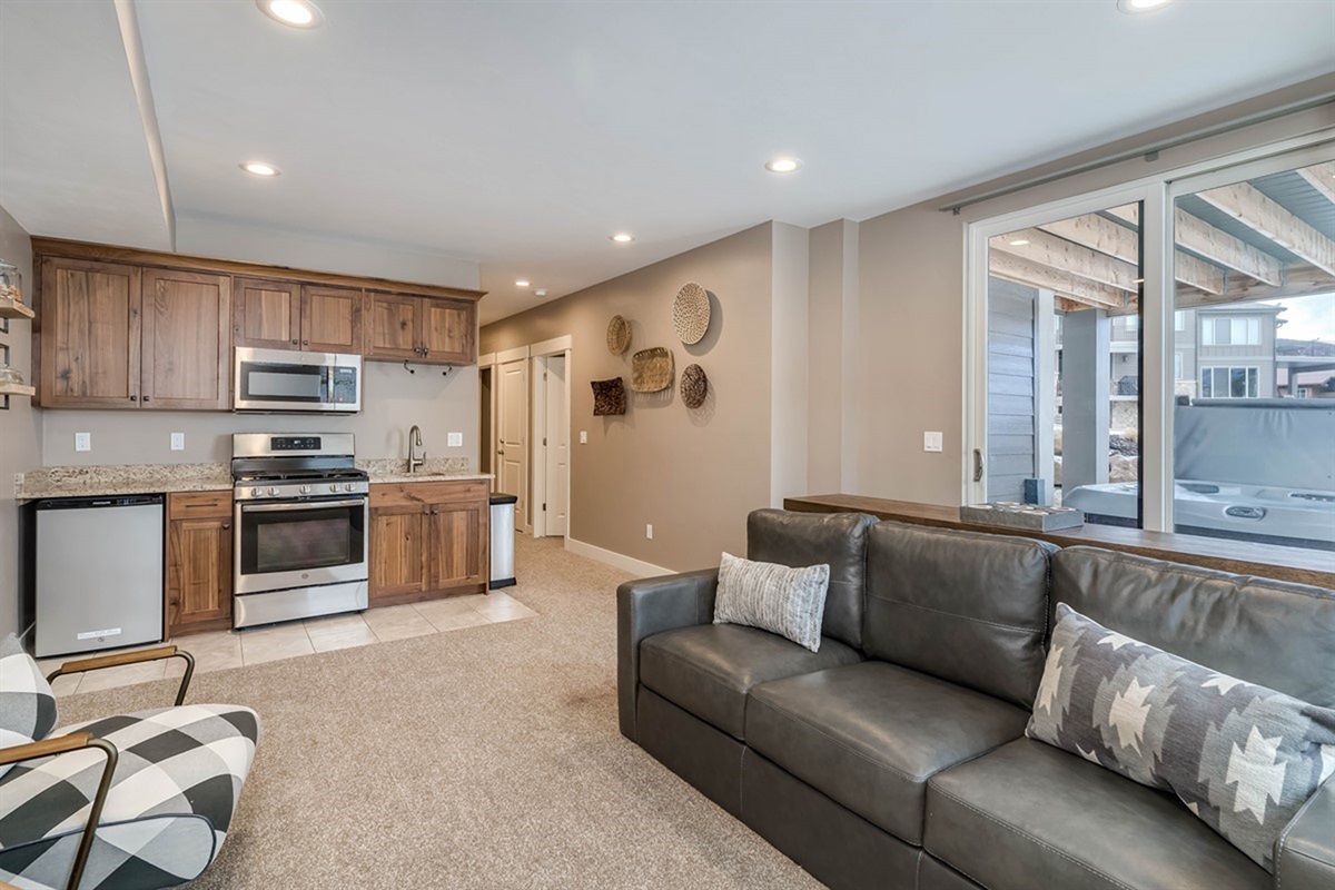 Lower-level family room with kitchenette—ideal for movie nights and lounging