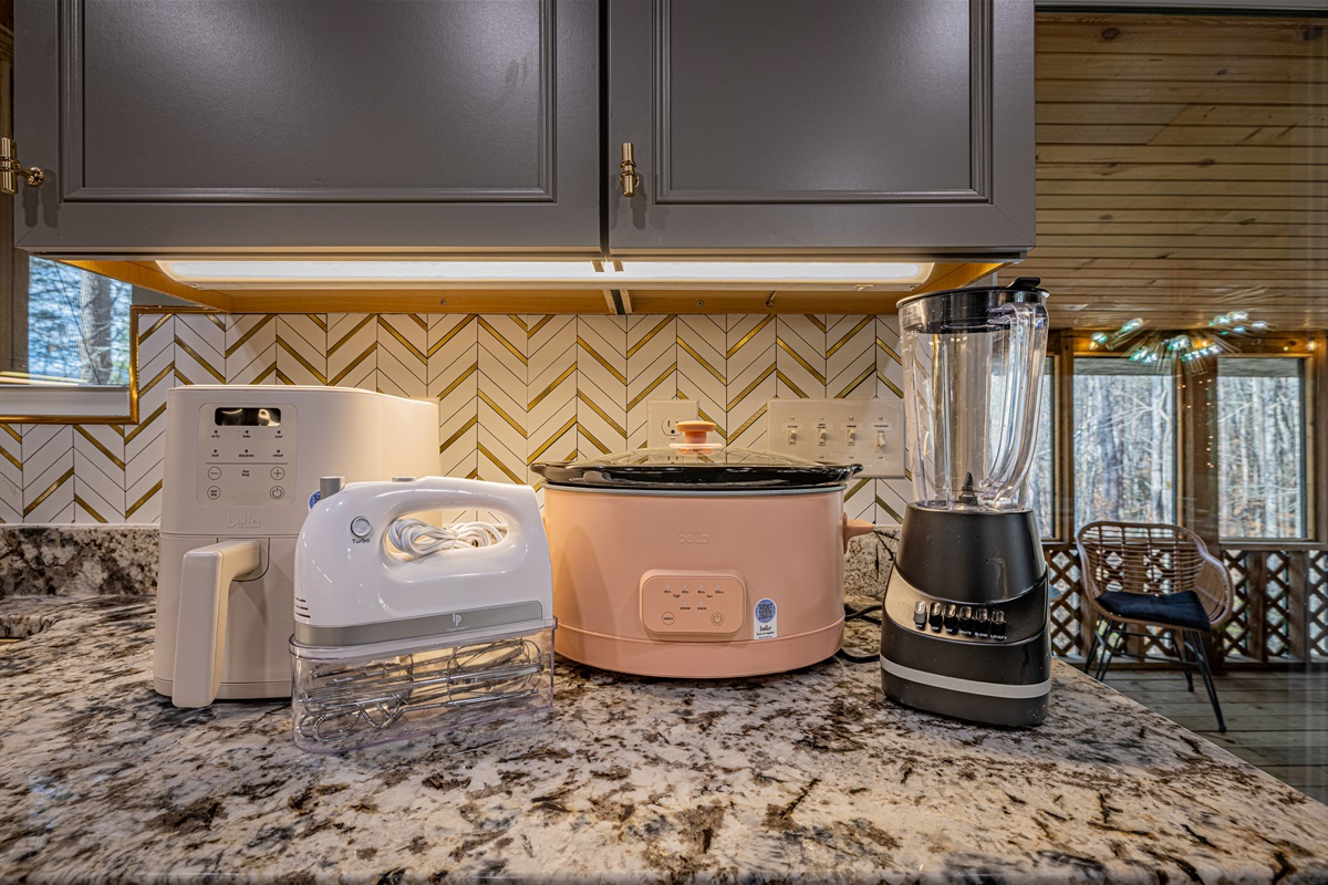 Enjoy the comforts of home with a fully equipped kitchen. The warm under-cabinet lighting creates a bright, inviting space for your morning routine.