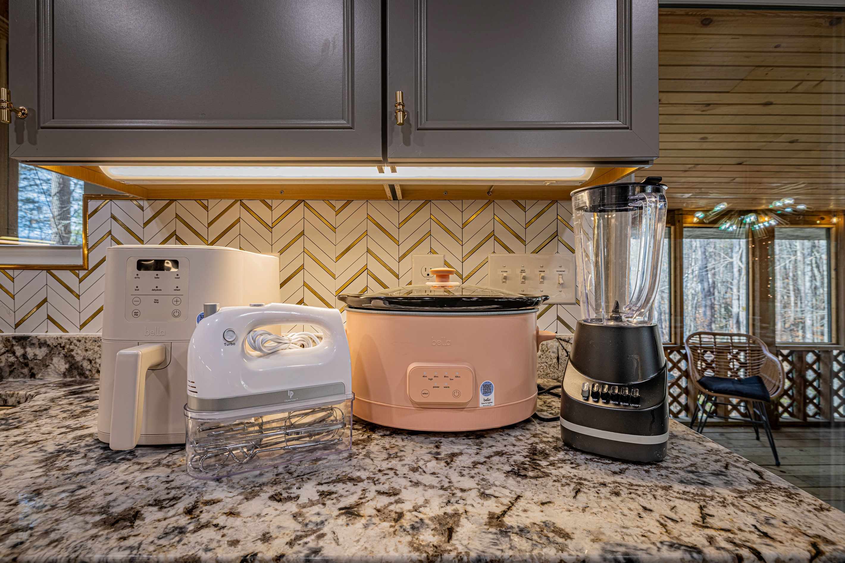 Enjoy the comforts of home with a fully equipped kitchen. The warm under-cabinet lighting creates a bright, inviting space for your morning routine.