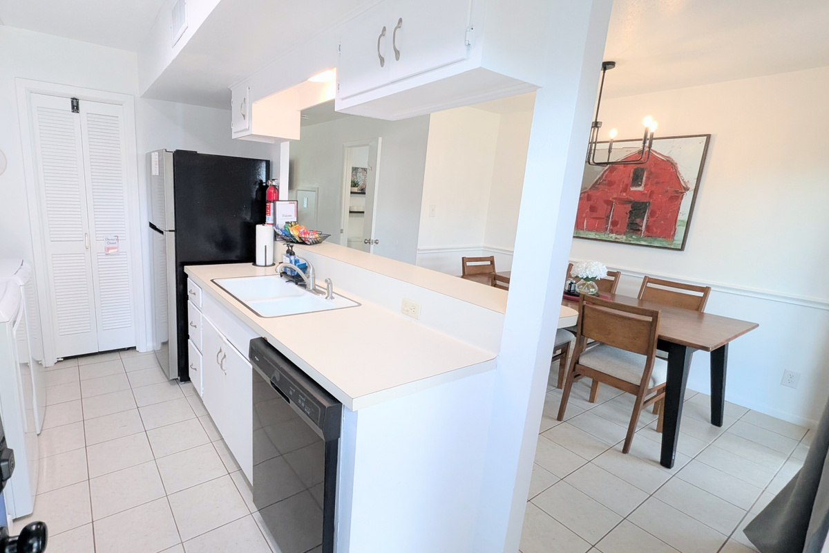 This clean, comfortable kitchen and dining space is located just inside the door from the carport and back courtyard.
