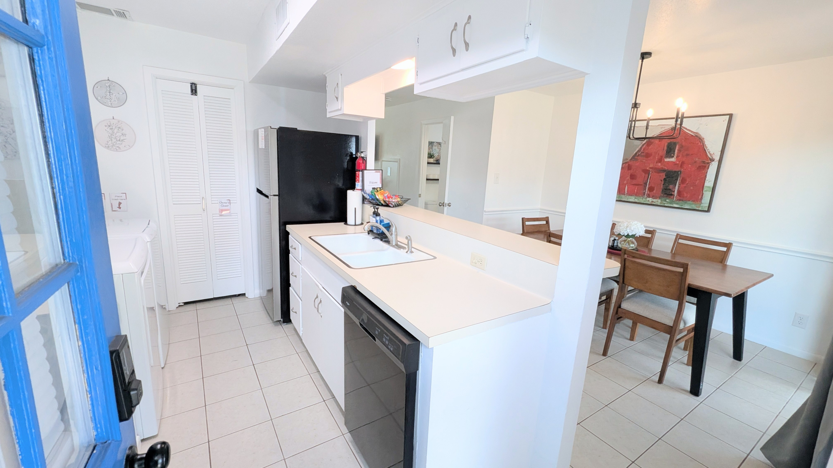 This clean, comfortable kitchen and dining space is located just inside the door from the carport and back courtyard.