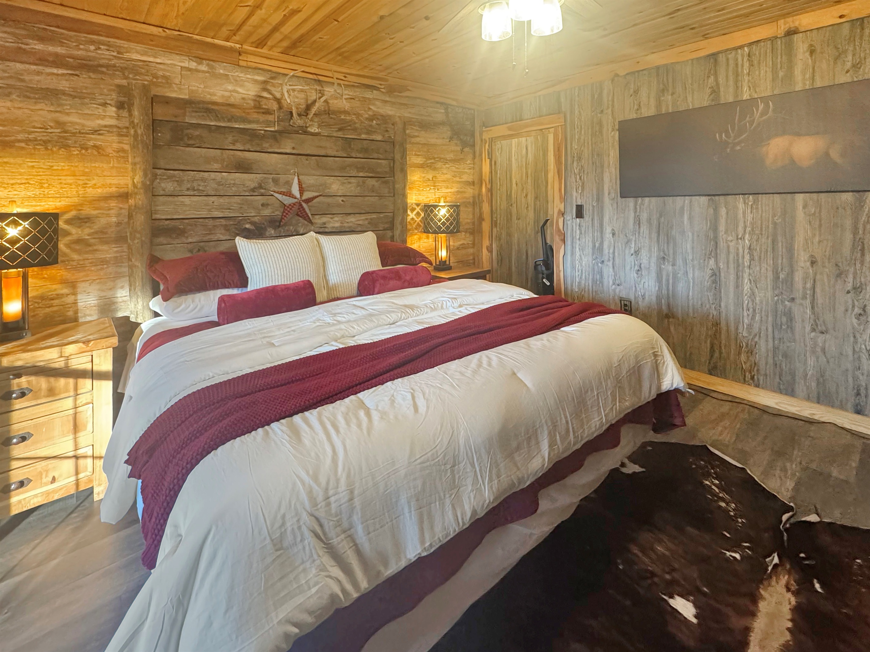 Luxury linens on a barnwood masterpiece - rest never felt so good.