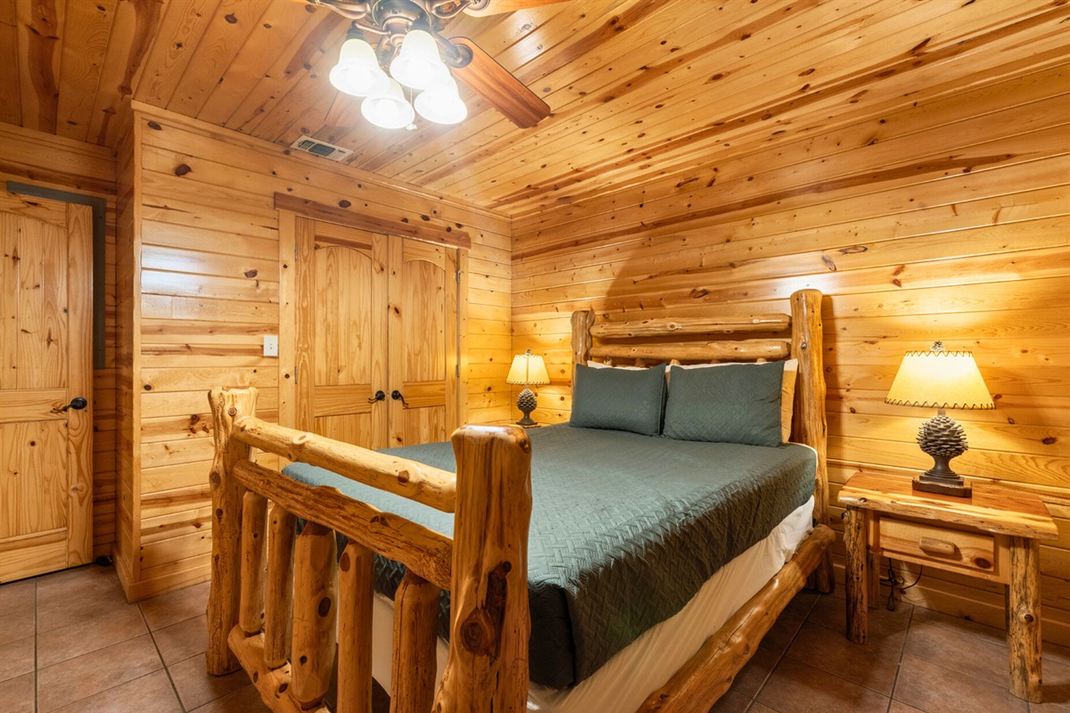 Another comfy bedroom with log bed and warm glow.