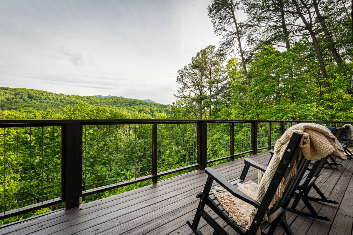 Rocking chairs offer additional seating on the main level deck.