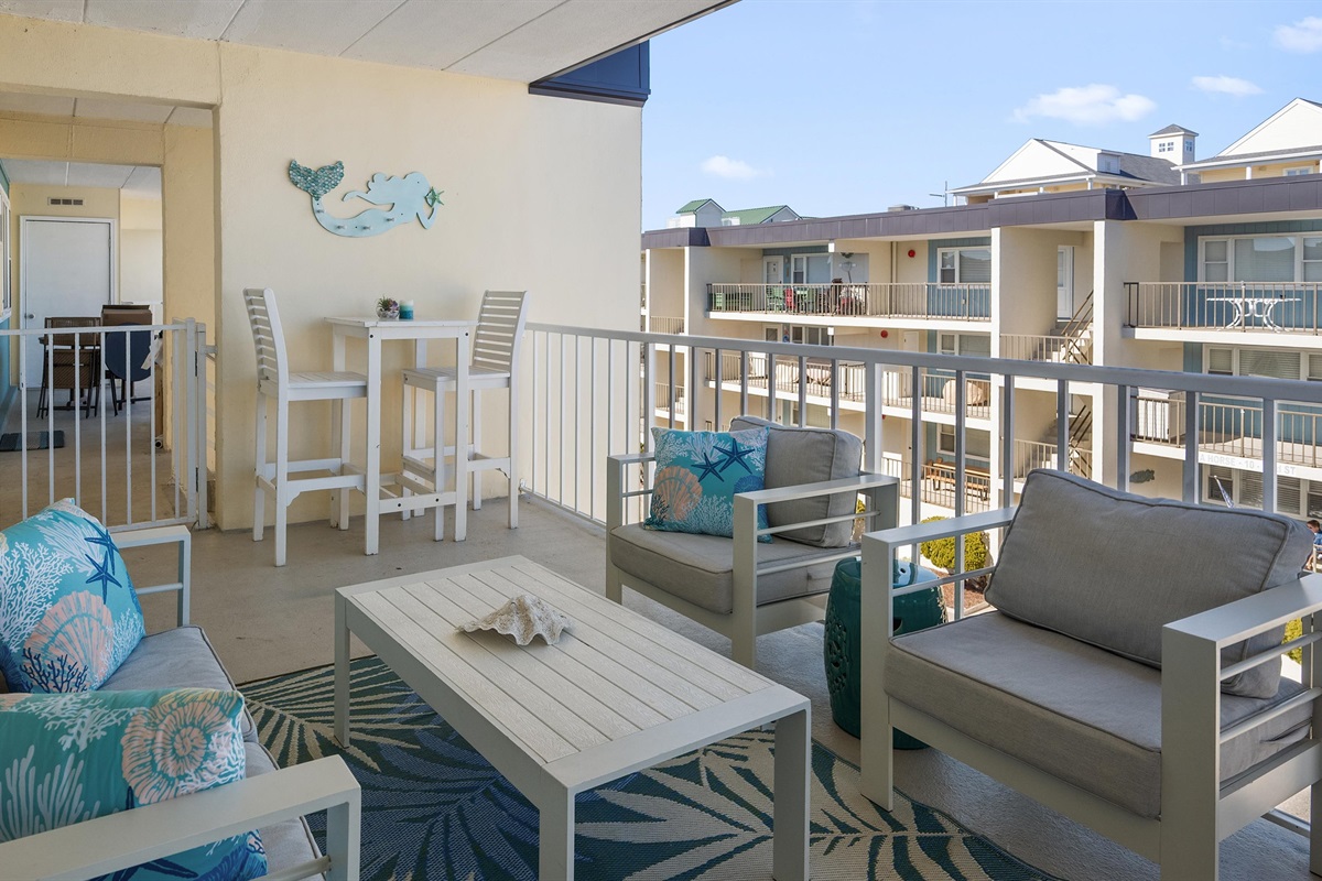 Gather the whole gang on the covered balcony