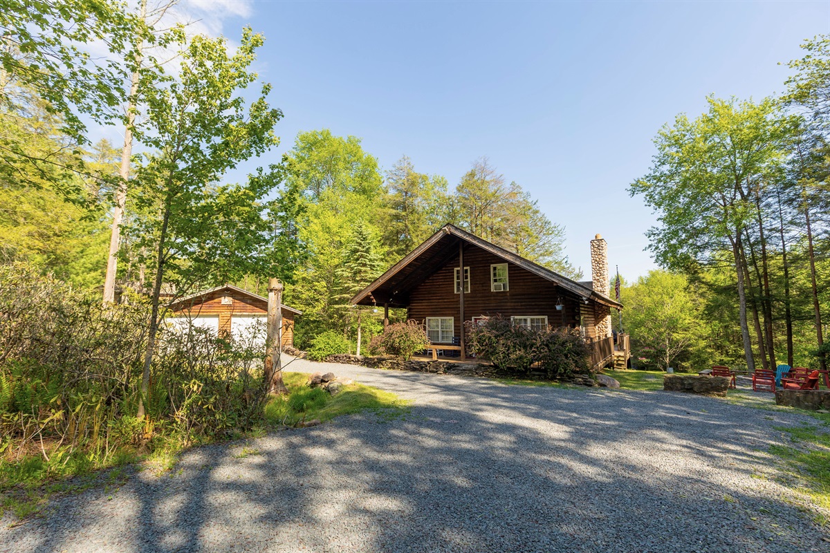 Escape to the beauty of the Poconos in this stunning creekside retreat. 