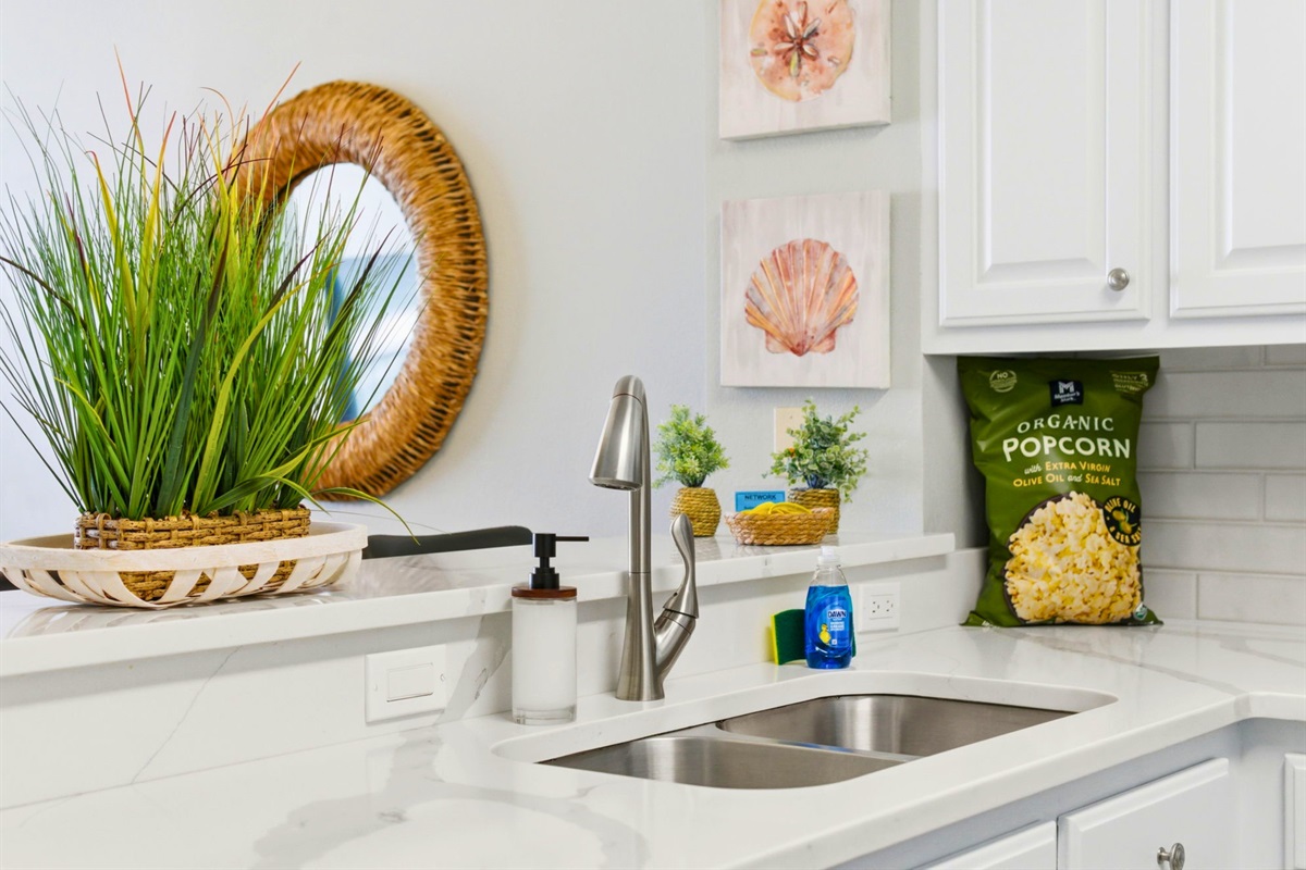 Thoughtful details and coastal-inspired accents add a cheerful touch throughout the kitchen space.