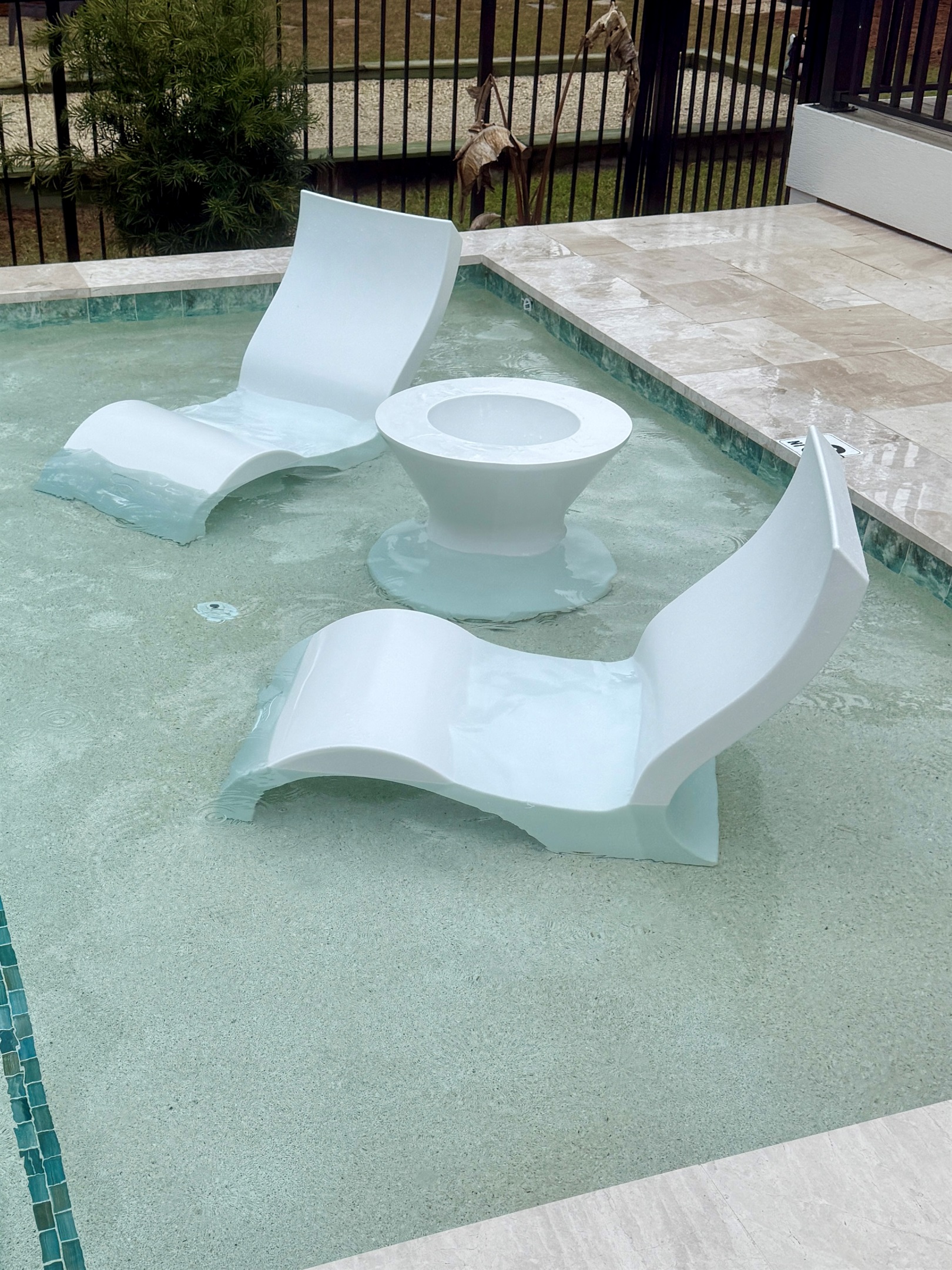 Ledge loungers with ice bin table — fill up the ice bin from the wet bar ice machine and enjoy cold drinks while you lounge the day away!