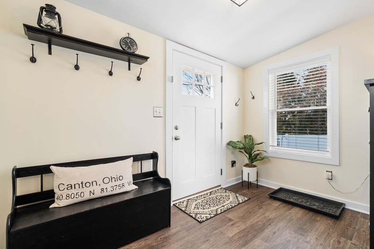 Additional mudroom storage and seating just inside the back entrance.