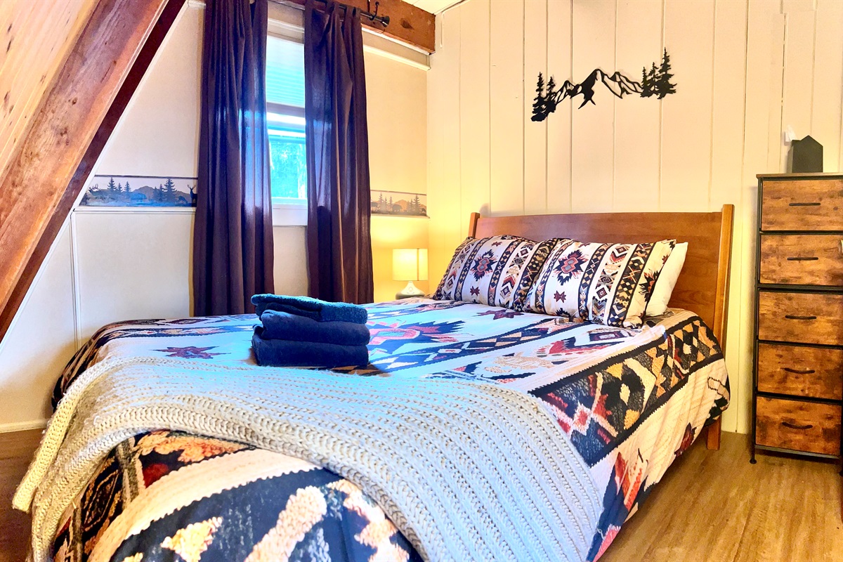 First floor bedroom with queen bed.