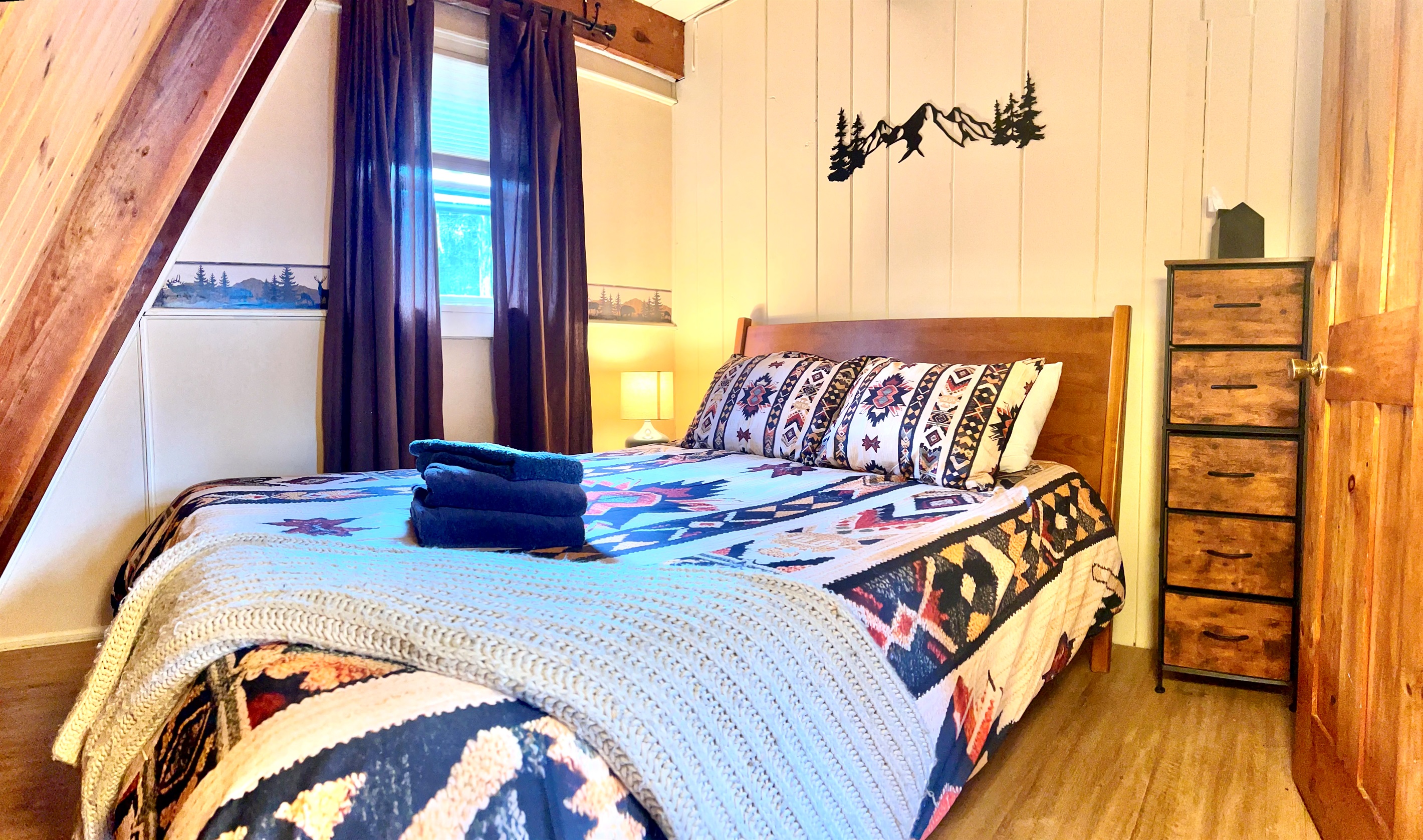 First floor bedroom with queen bed.