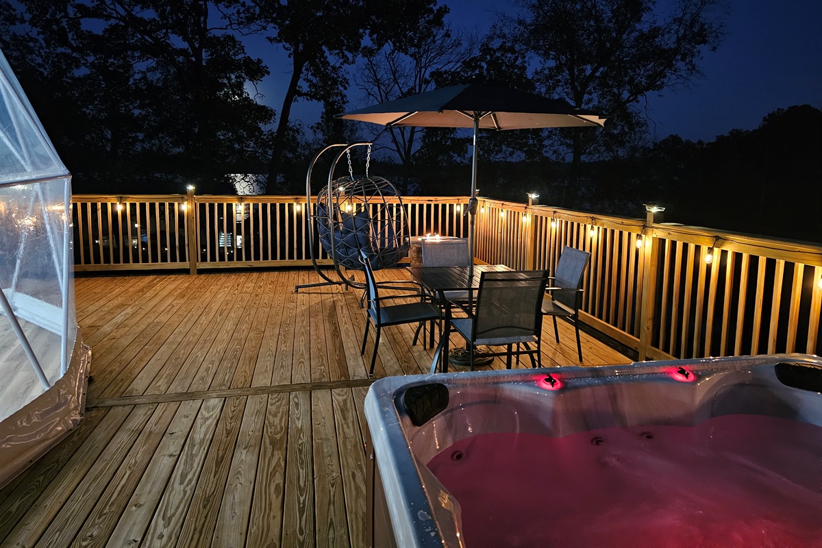 Your own spacious deck with a glowing hot tub and cozy seating—designed for unforgettable nights at the lake