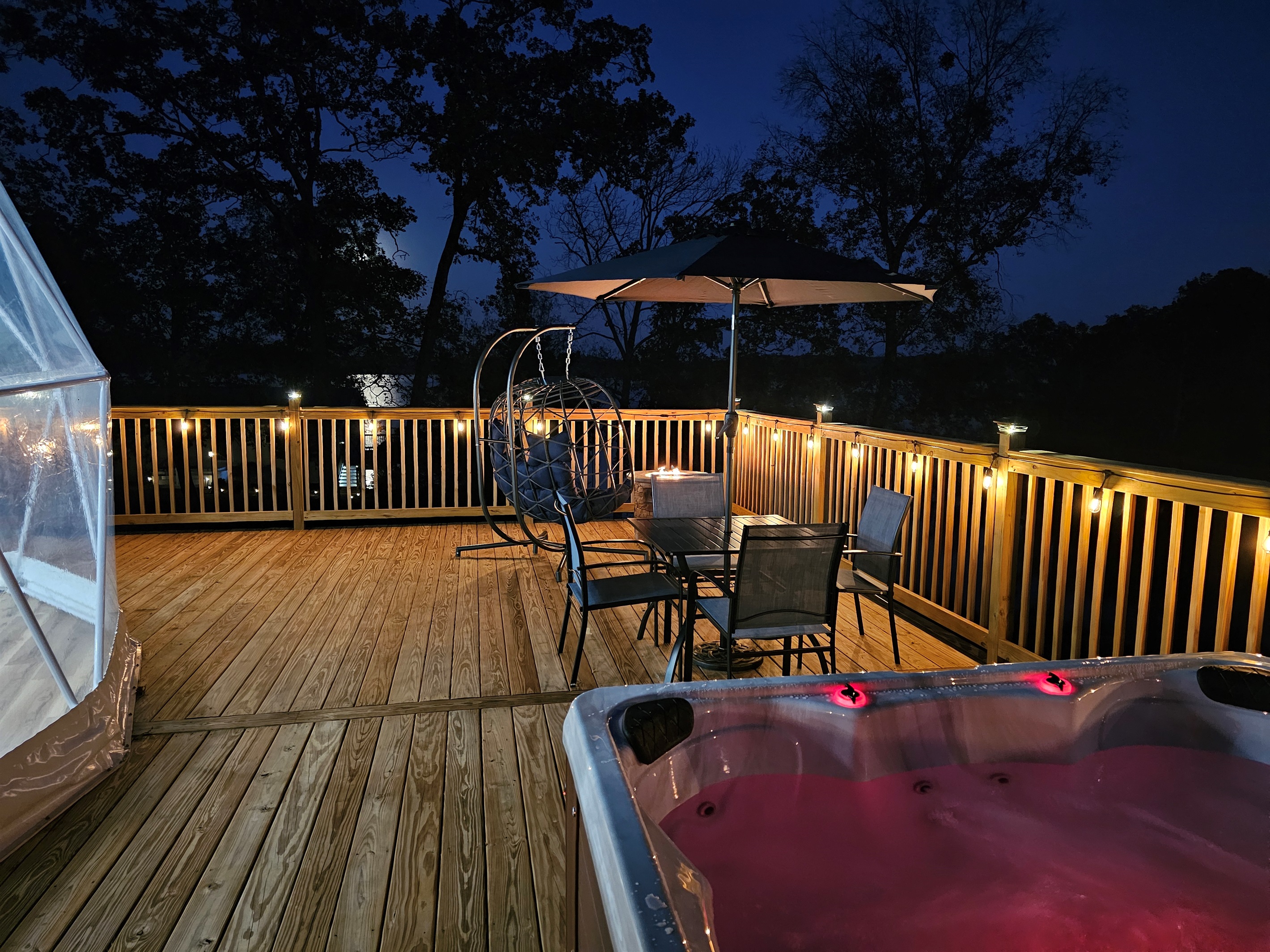 Your own spacious deck with a glowing hot tub and cozy seating—designed for unforgettable nights at the lake