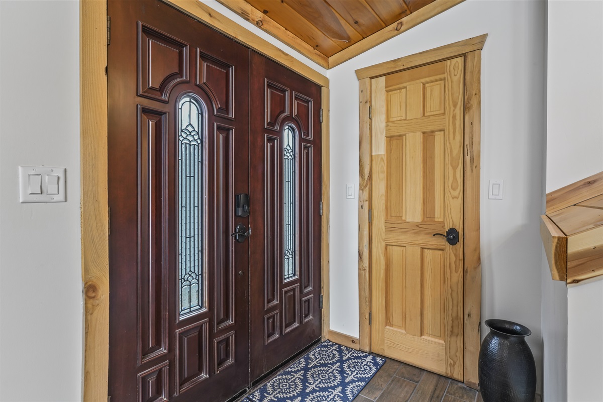 Entrance from inside of house with hall closet